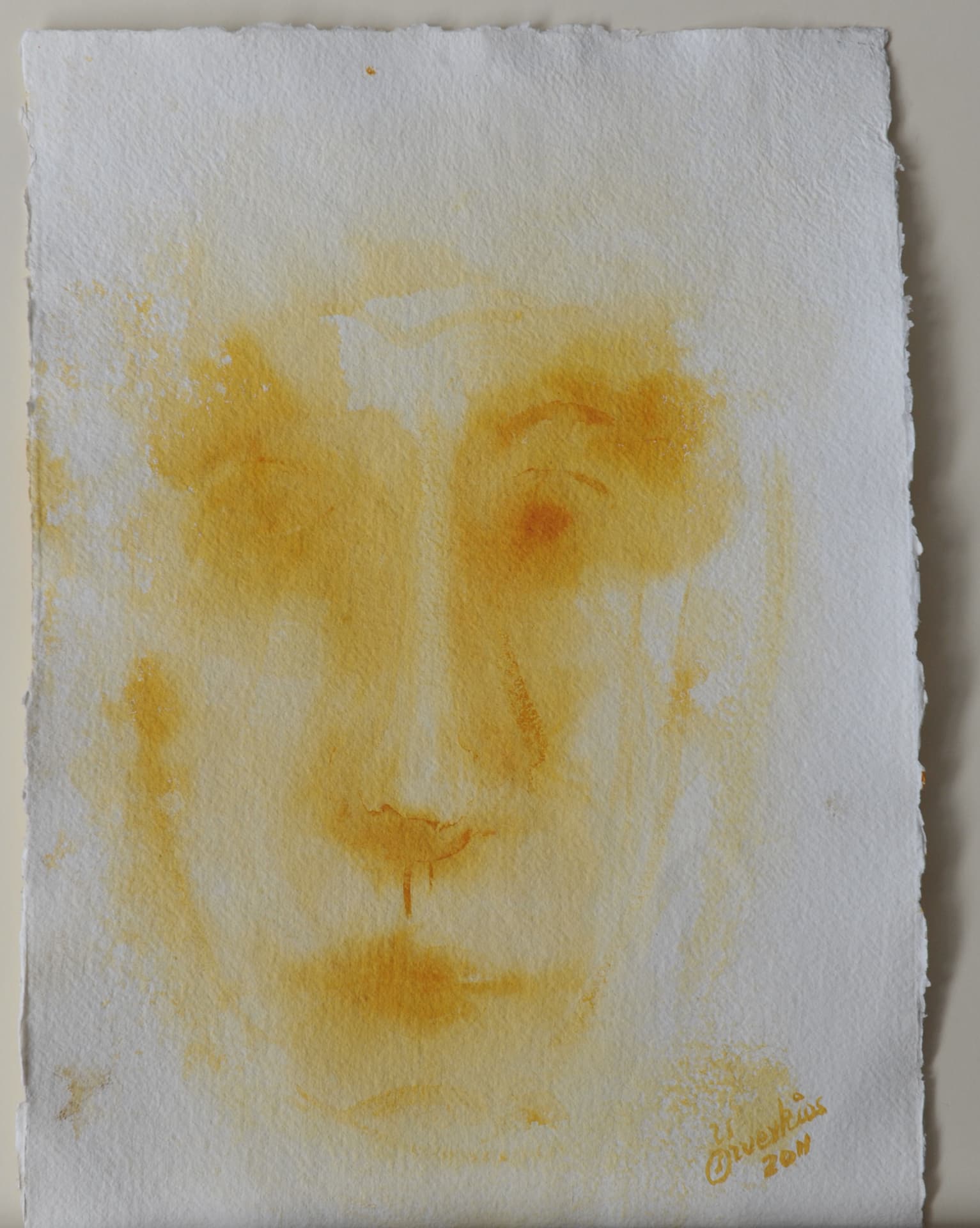 Very faint face in pale yellow watercolor on white deckle-edged paper
