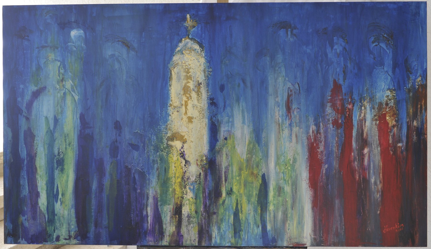Landscape-format painting of a tall pale-yellow tower topped with a cross among elongated upright forms against a blue background