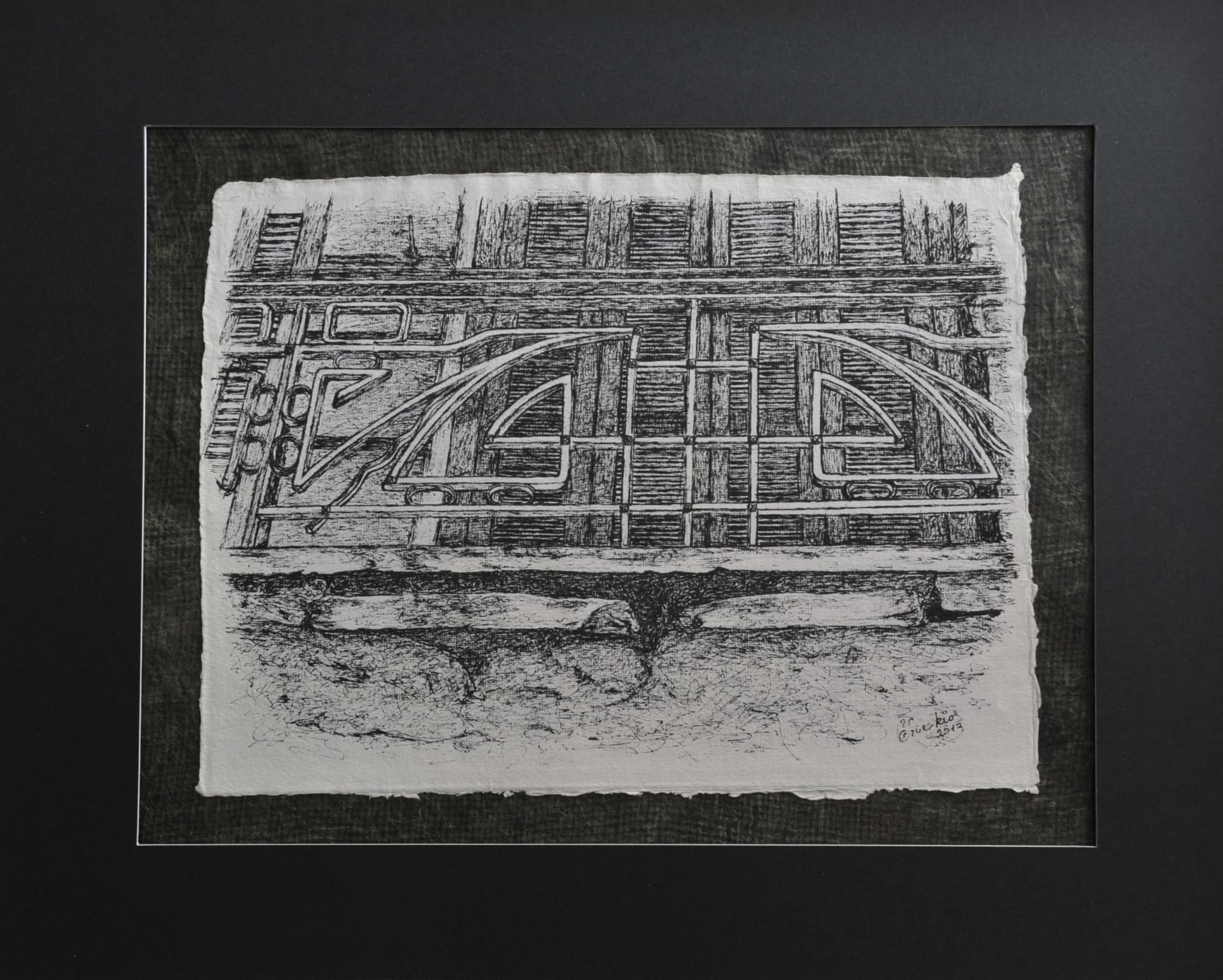 Landscape-format ink drawing of a decorative metal balcony railing in front of shuttered openings, on paper mounted on a dark charcoal-grey mat