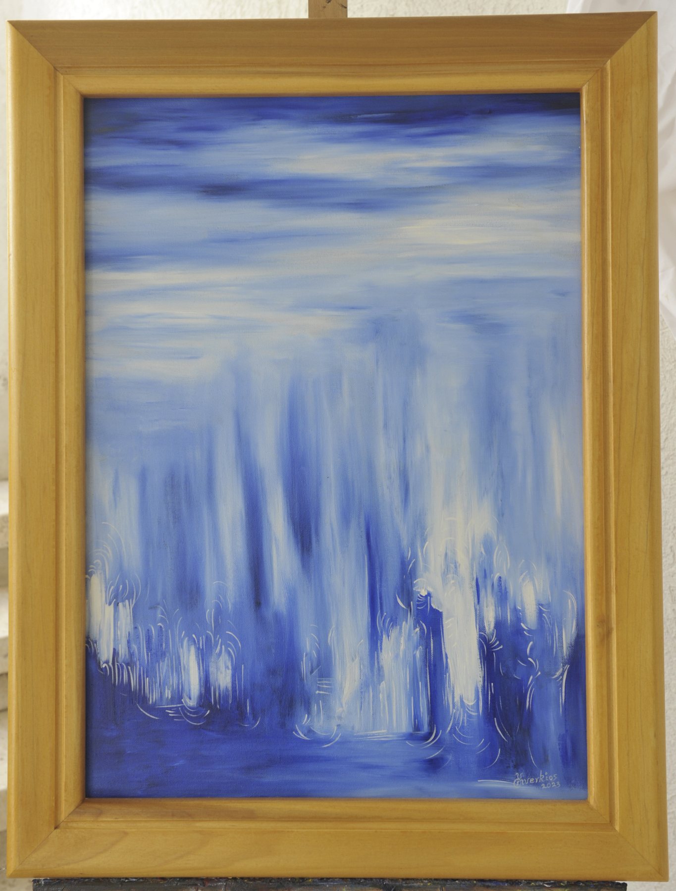 Portrait-format abstract painting with vertical streaks, soft washes and fine white curved lines in blue and white, in a wooden frame