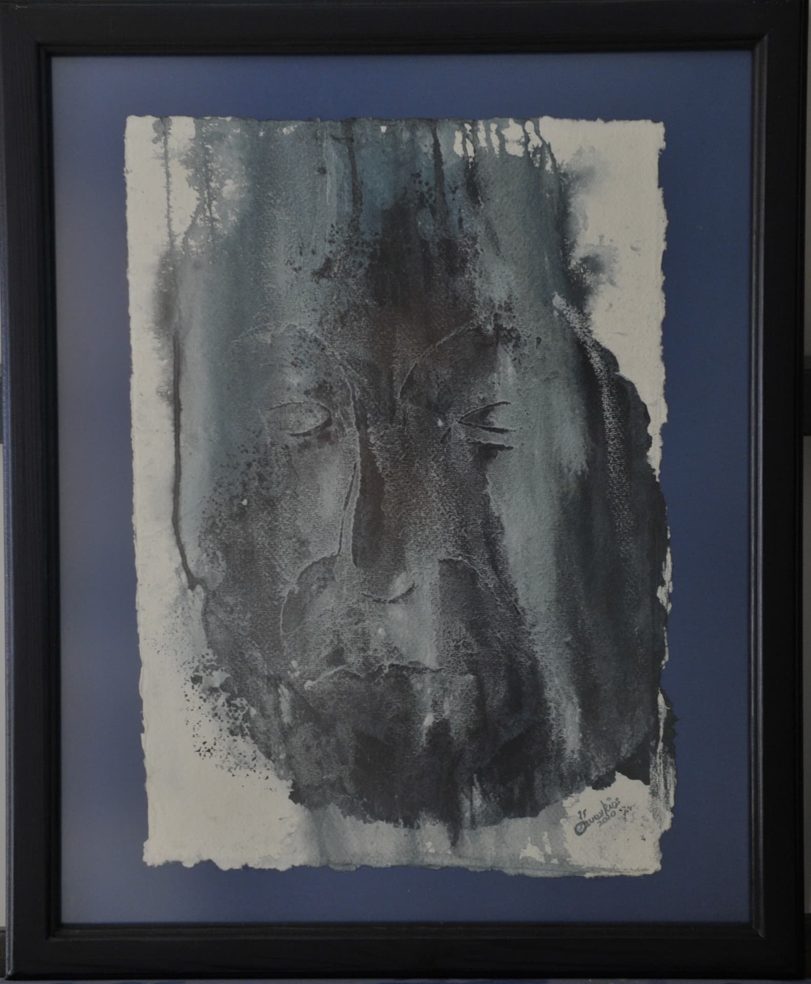 Semi-abstract face with closed eyes formed by vertical bleeding washes and splatter, in charcoal grey and black on paper mounted on a blue mat