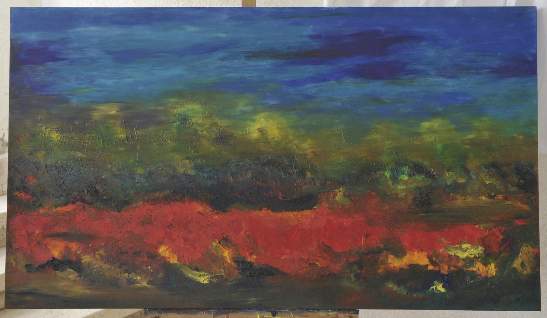 Landscape-format abstract painting of horizontal textured bands of paint in blue, green and red