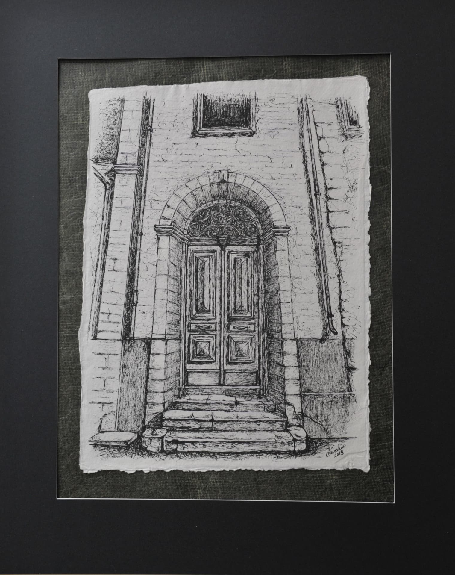 Ink drawing of an arched stone doorway with double wooden doors and steps, on paper mounted on a dark charcoal-grey mat
