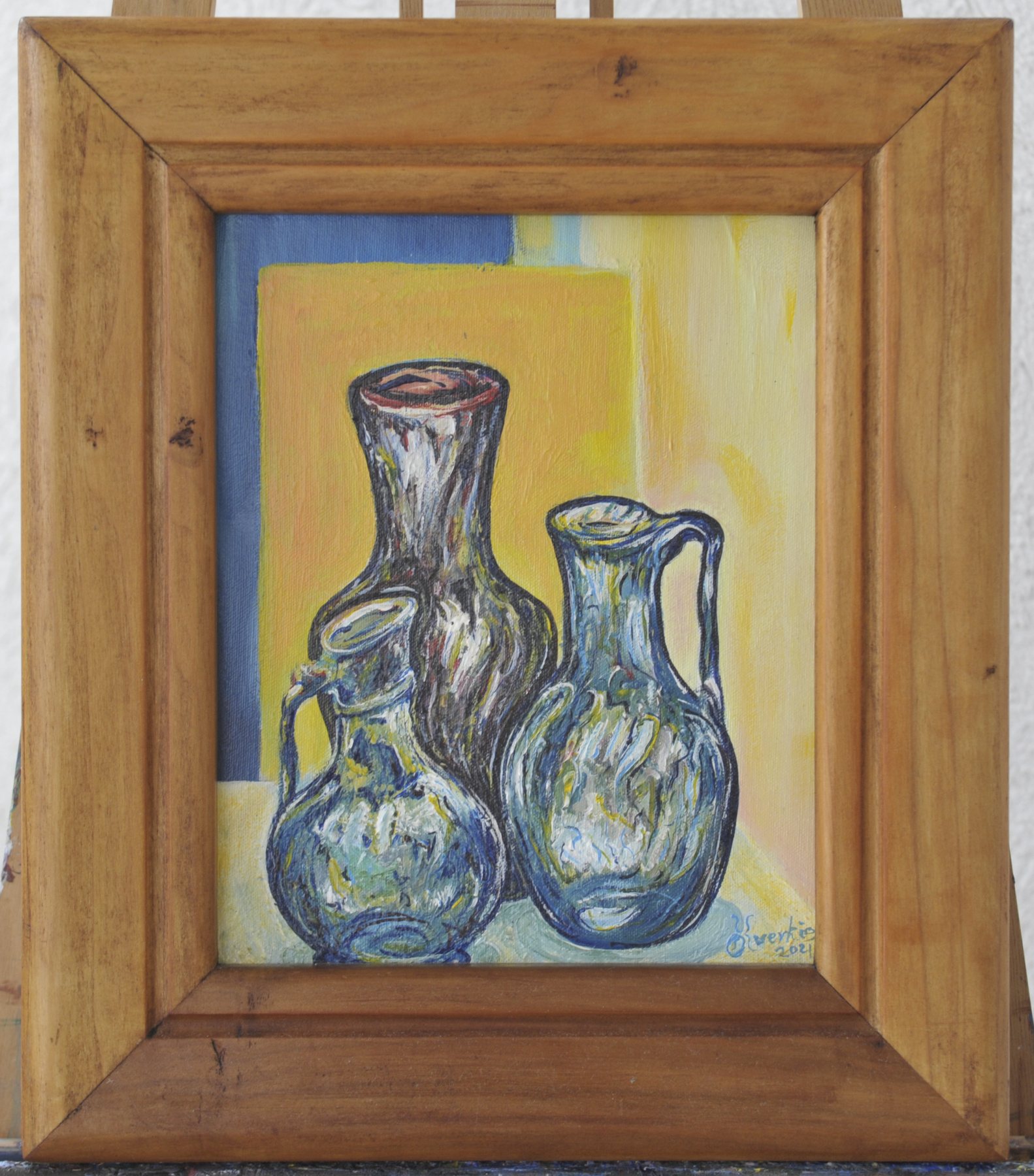 Painting of three jugs set against yellow and blue panels, in a wooden frame