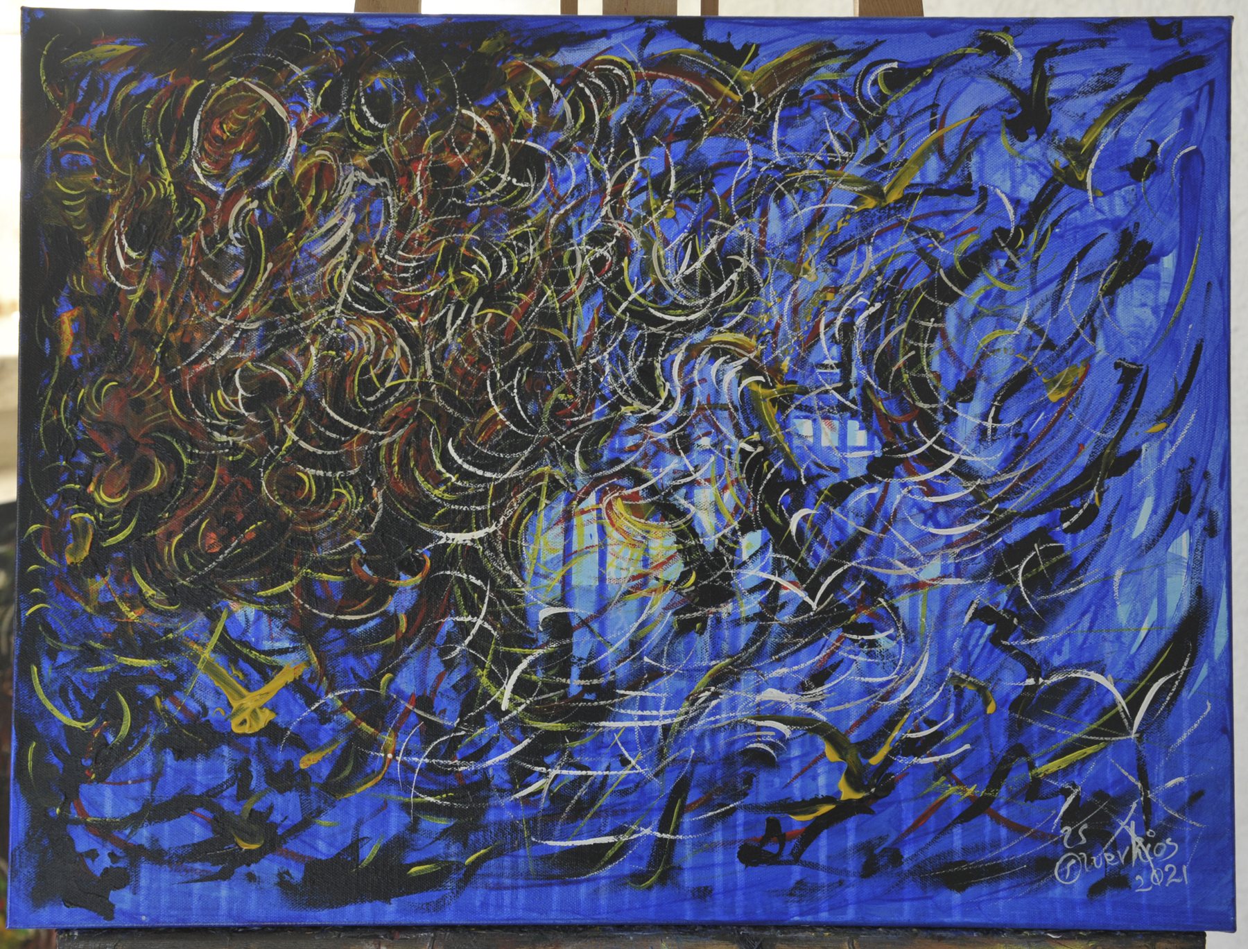 Landscape-format abstract painting with dense clusters of curved crescent-shaped strokes in black, white and yellow over a blue field
