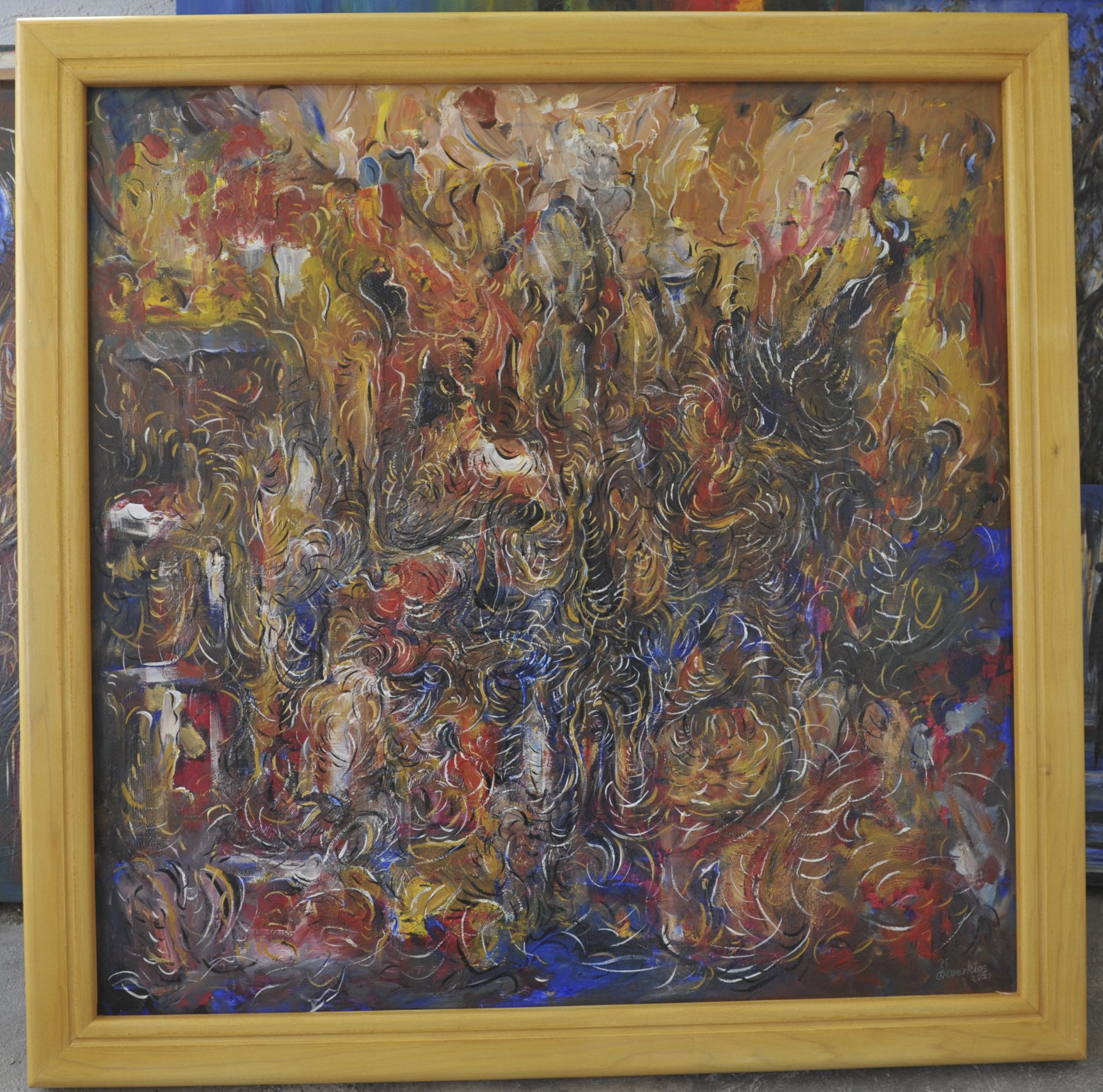 Abstract painting with a dense network of swirling, curled lines across textured brushwork in ochre, brown, red and black, in a wooden frame