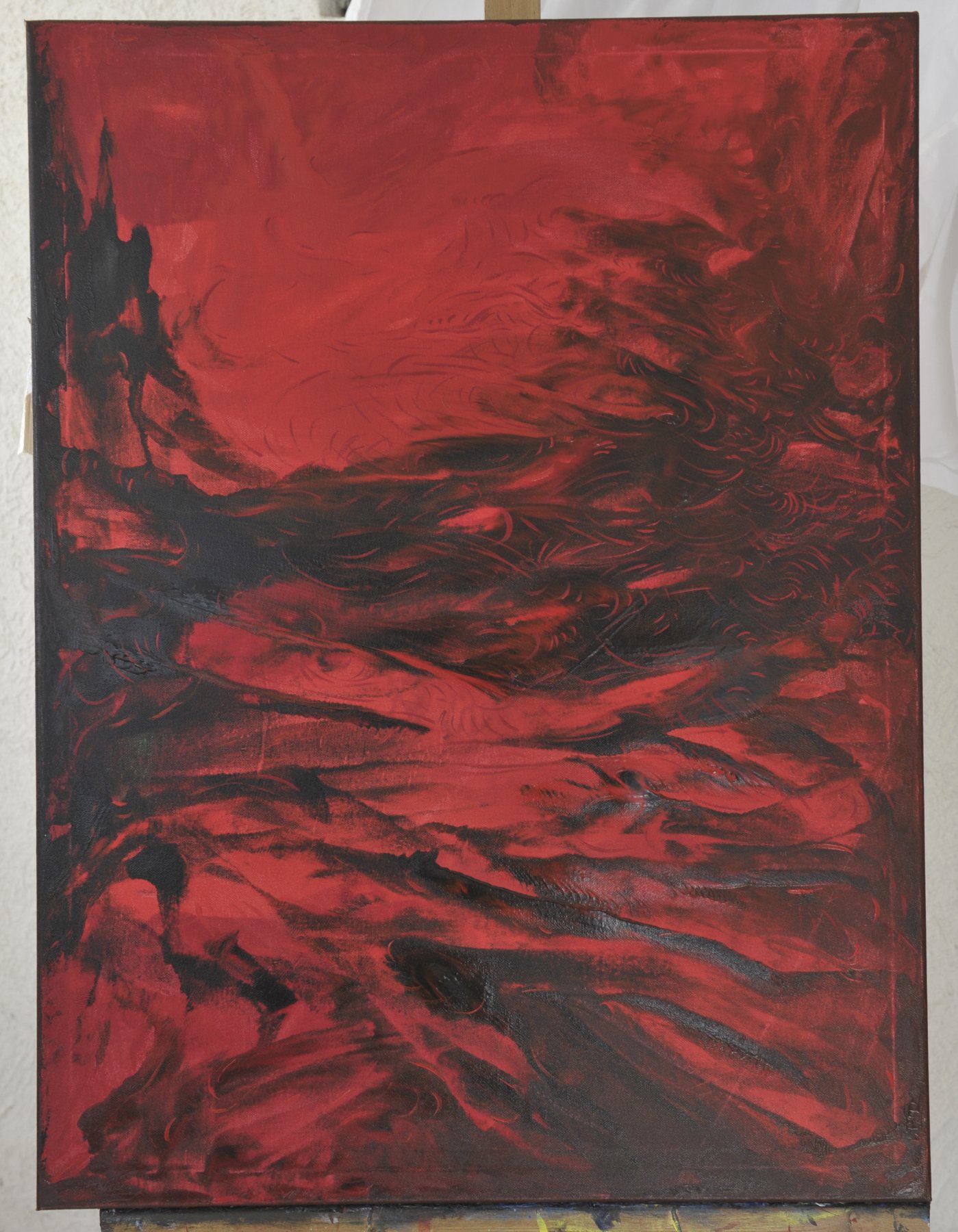 Portrait-format abstract painting with sweeping swirling strokes and dark textured crests in red and black