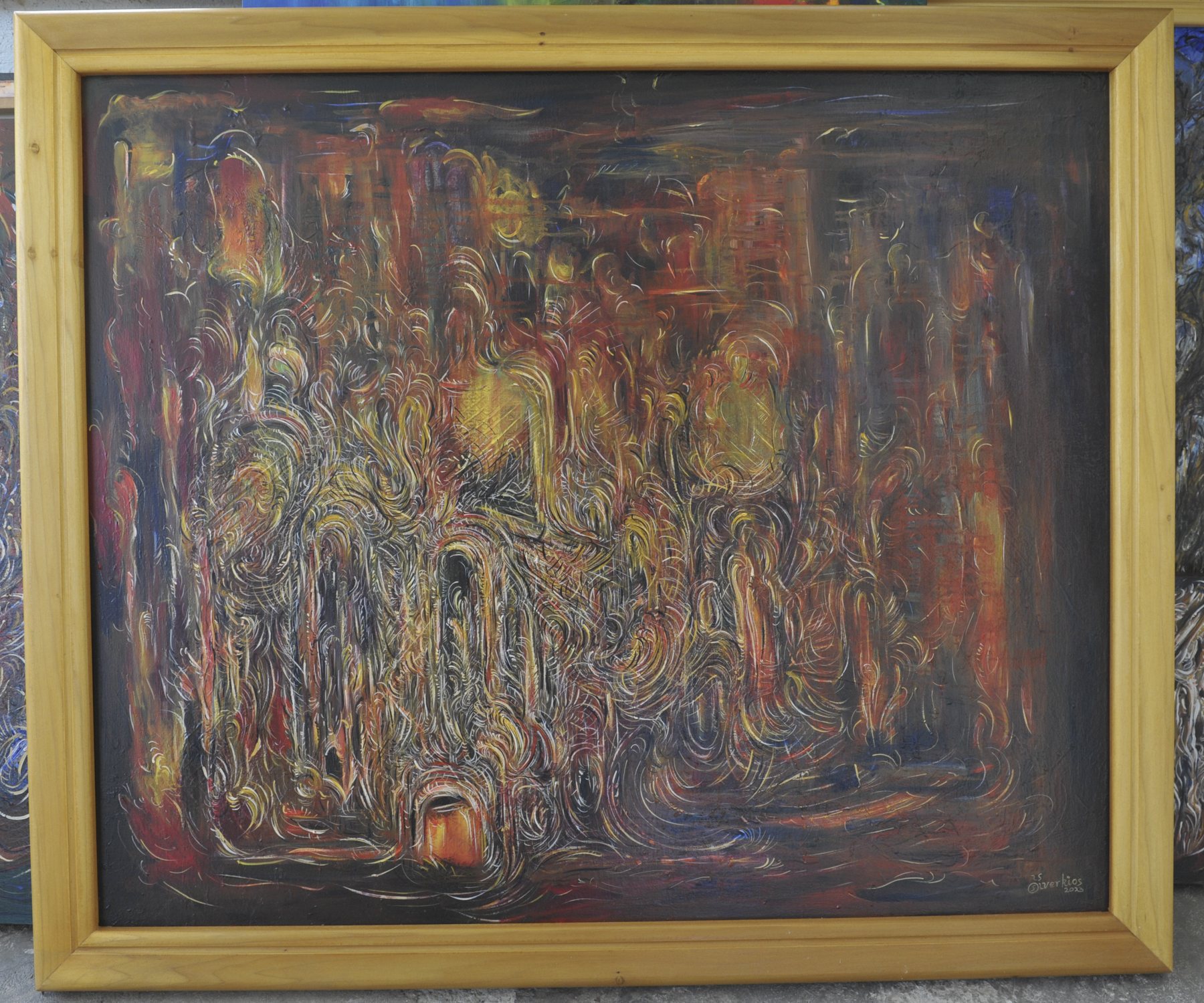 Abstract painting with dense swirling lines forming vertical strokes and arch-like shapes in orange, dark red and yellow, in a wooden frame