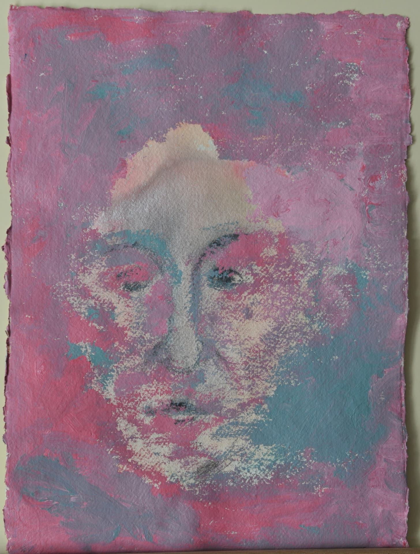 Face emerging from heavily textured pink and blue-violet pigment on deckle-edged paper
